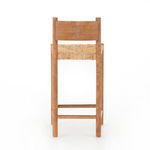 Rear view showing full wooden backrest and woven seat underneath