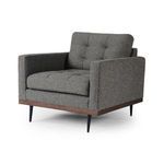 Lexi Solid Almond Parawood Accent Chair with tufted dark gray fabric, almond wood base, and black tapered legs