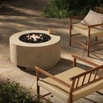Alternative outdoor setup showing fire table with fire burning between chairs on tiled patio