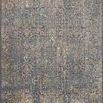 Rectangular contemporary rug in indigo and sunset colors with distressed, intricate faded patterns and varied pile heights