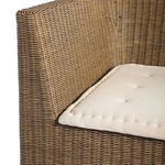 Detail of seat corner focusing on weave pattern under tufted cushion
