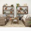Living room styled scene featuring Havana Sofa with neutral cushions, plants, wooden coffee table, and shelves