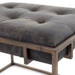 Closer angle showing floating leather top surrounded by antique brass cage support