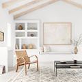 Shag rug styled in bright Scandinavian living room with natural light, wood beams, woven chair, and minimalist decor