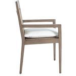Three-quarter view of Savannah Aluminum Oak/Raffia Arm Chair with light wood frame, woven panels, and white cushion
