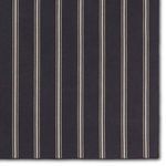 Top down close-up of navy rug with thin and thick ivory stripes showing weave detail