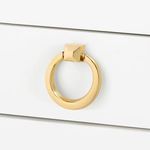 Polished gold finish metal ring pull handle variant on Polo side table drawer