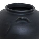 Close-up on one small handle and rolled lip detail of the black terracotta vase