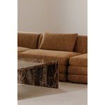 Lowtide Modular Sectional styled in living room near marble coffee table and neutral wall