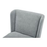 Close-up of the softly curved top edge and padded upholstery on the chair’s backrest