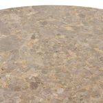 Top-down close-up showing the natural variations in the onyx tabletop surface