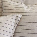 Close-up focusing on corner seam and vertical dark stripes of the Blake duvet's linen fabric texture