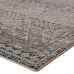 Close-up angled view showing the textured weave and detailed tribal pattern in muted tones