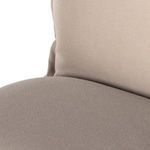 Zoomed-in fabric texture on seat cushion surface in taupe color