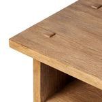 Close-up of tabletop edge with visible wood grain and fine distressed finish