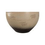 Close-up of Moriko Lamp’s round sandy clay base texture and ombré blending from beige to black
