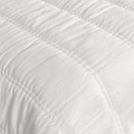 close-up of quilt’s channel stitching and soft, slightly textured ramie fabric surface