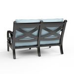 Back view revealing crossed design in dark espresso aluminum frame of Monterey Loveseat