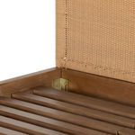 Close-up of inner corner joint between wood frame and woven headboard with metal brackets