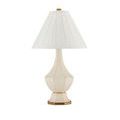 Musetta Table Lamp side angle with lit ivory shade and brass finial