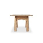 Close angle on table corner showing smooth rounded edges and wood tone