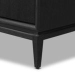 Tapered black oak leg on the base of Rosenell Media Console with fine grain detail