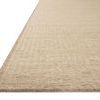 Low angled view showing thickness and flat weave texture of Loloi Elma Natural Rug