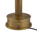Base detail with charging indicator illuminated red and visible power cord attached