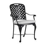 Three-quarter front left angle showing chair’s sculpted legs and thick seat cushion
