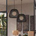 Black pendant with Kraft paper twine casting shadows on white background, hanging by short chain