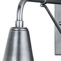 Close-up angle of sconce's shade and arm junction with textured silver finish
