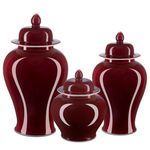 Set of three oxblood temple jars in varying sizes displayed side by side on white background
