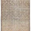 Antiqued beige, green, and blue vintage-style trellis pattern area rug with intricate border, flat weave