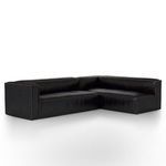 Angle view from opposite side emphasizing sectional's sleek cushions and leather finish