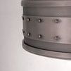 Close-up of pendant side showing detailed rivet heads and textured perforated steel band
