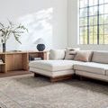 Maria Taupe/Blue Elena rug shown in a bright living room under a beige sectional sofa