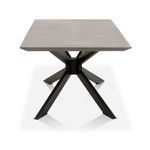 Dining table front view showing square concrete top and angled iron legs from pedestal base