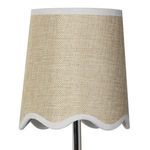 Detailed view of scalloped edge and woven texture on beige linen shade of Ariel sconce