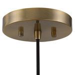close-up of round antique brass ceiling canopy with black cord attachment