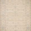 Full view of Priya Natural / Blue Rug showing symmetrical floral border and central medallion pattern in soft blues and ne...