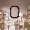 Hunter Desk styled with mirror, pink lampshade, golden shelves, and white chair on pink rug