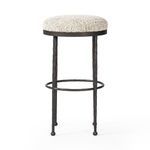 Corinne Stool shown front facing with visible circular footrest at bar height