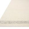 Reyla Ivory/Silver Rug shown from a low angled view highlighting the flat weave and silver border detail