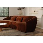 Sectional styled in a living room with decorative pillows and neutral decor