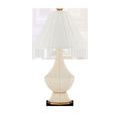 Musetta Table Lamp with white shade viewed from a slight side angle