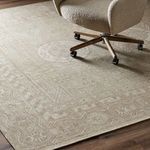 Office space showing the rug beneath a swivel chair with wooden floor visible