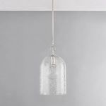 Pendant shown hanging against light gray wall with visible decorative floral etching on glass