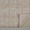 Back of rug partially folded to reveal a neutral non-slip backing with grip texture