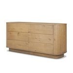 Angled side-front view showing dresser’s rounded corners and oak wood grain
