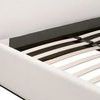 Close-up of wooden slat foundation inside upholstered footboard corner